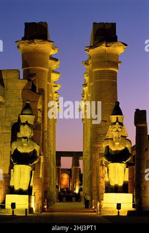 Entrance to the Temple of Luxor lit up at night, Luxor Egypt Stock Photo