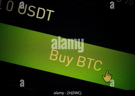 Close up shot of a computer screen with the mouse cursor on the Buy Bitcoin button. Stock Photo