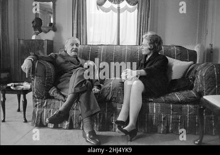 British writer William Somerset Maugham photographed on his settee in the living room of his home. April 1959. Stock Photo
