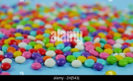 colorful sweet candy balls on blue pastel background. trendy color. Stock Photo