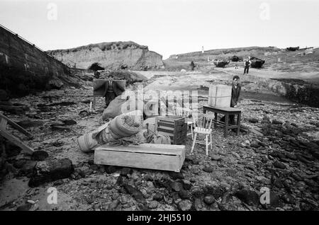 The last twenty three residents of Inishark Island (sometimes called Shark Island), off the coast of County Galway, Ireland, are pictured evacuating the Island. The residents have lost their battle with the winds. After being cut off from the mainland for weeks, sometimes months on end, the six families have left for the mainland to live in houses provided by the Irish government. 21st October 1960. Stock Photo