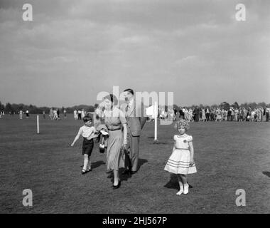 Queen Elizabeth II with Prince Charles and Princess Anne at Windsor Great Park to watch the Duke of Edinburgh playing polo. 13th May 1956. Stock Photo
