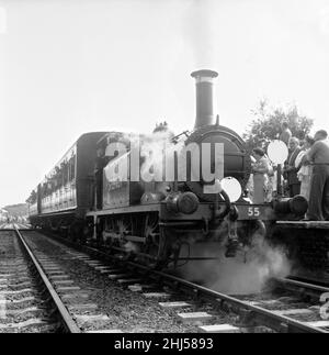 Crowds on the platform at Horsted Keynes station await the arrival of the London, Brighton & South Coast Railway locomotive  No. 55 'Stepney', a Bluebell Line train from Sheffield Park.  8th August 1960. Stock Photo