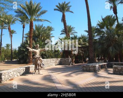 INDIO, CALIFORNIA - JULY 15, 2018:  A sculpture depicting Jesus riding a donkey on Palm Sunday, is part of a biblical garden walk featured at Shield's Stock Photo