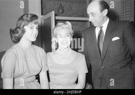 Lana Turner, american film actress pictured during interview with Daily Mirror journalist Donald Zec, at a hotel in London, Sunday 29th December 1957. Also pictured, Lana's 14 year old daughter Cheryl Crane, nickname Cherry. Stock Photo