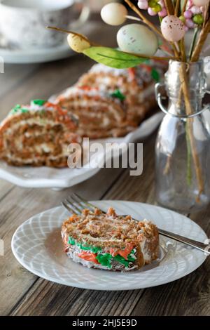 Jelly roll carrot cake with cream cheese icing for Easter brunch. Stock Photo