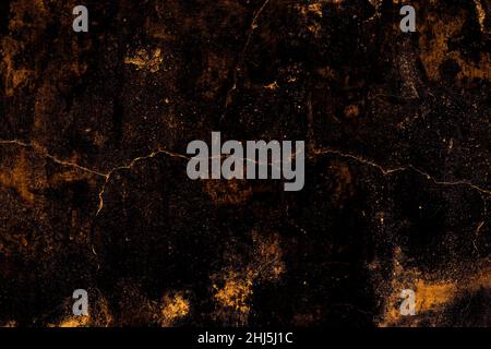 Saturated orange color grunge textured old concrete wall surface with cracks for background Stock Photo