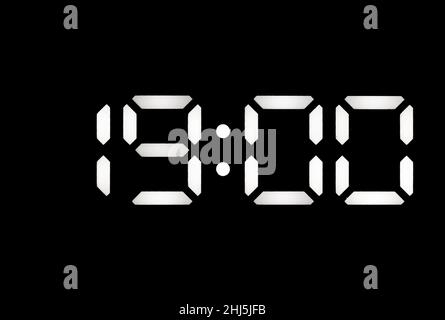 Real white led digital clock on a black background showing time 19:00 Stock Photo