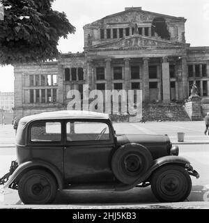 Scenes in East Berlin, East Germany showing daily life continuing as normal soon after the start of the construction of the Berlin Wall. Picture shows the ruined Schauspielhaus Berlin concert hall situated on the Gendarmenmarkt square in the central Mitte district of Berlin. It was severely damaged by Allied bombing  and the Battle of Berlin during the Second World War. 18th August 1961. Stock Photo