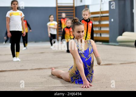 Visoko, Bosnia and Herzegovina. 26th Jan, 2022. Sara Becarevic (front) practises rhythmic gymnastics at the gym in Visoko, Bosnia and Herzegovina, on Jan. 26, 2022. Sara Becarevic is a 14-year-old girl from Visoko, a town 35 kilometers from the capital of Bosnia and Herzegovina, Sarajevo. She was born without a left forearm which didn't stop her from realizing her dream and doing rhythmic gymnastics. Sara started training at the age of nine with a lot of effort and has already achieved numerous success, even at international competitions. Credit: Nedim Grabovica/Xinhua/Alamy Live News Stock Photo