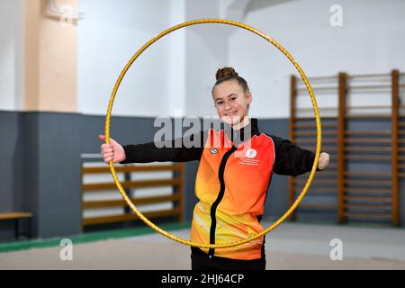 (220127) -- VISOKO, Jan. 27, 2022 (Xinhua) -- Sara Becarevic poses for a photo after her rhythmic gymnastics practice at the gym in Visoko, Bosnia and Herzegovina, on Jan. 26, 2022. Sara Becarevic is a 14-year-old girl from Visoko, a town 35 kilometers from the capital of Bosnia and Herzegovina, Sarajevo. She was born without a left forearm which didn't stop her from realizing her dream and doing rhythmic gymnastics. Sara started training at the age of nine with a lot of effort and has already achieved numerous success, even at international competitions. (Xinhua/Nedim Grabovica) Stock Photo