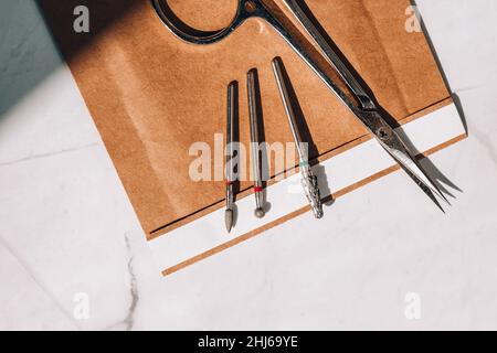 Clean manicure instruments. Manicure set in paper heat dry bag for sterilization. Sterilization of instruments healthcare concept Stock Photo