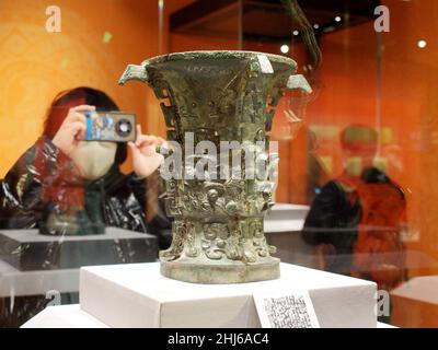 BEIJING, CHINA - JANUARY 26, 2022 - Visitors look at 'Harmony (Western Zhou Dynasty)' at the 'Why China' exhibition at the Mandarin Hall of the Palace Stock Photo