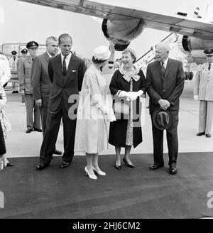 Queen Elizabeth II and The Duke of Edinburgh welcome President Eisenhower and his wife when they arrived by air from Washington at the Royal Canadian Air Force base at St Hubert, near Montreal. 26th June 1959.