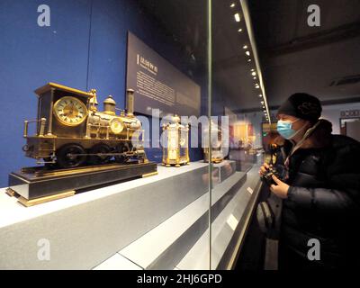 BEIJING, CHINA - JANUARY 26, 2022 - Visitors look at 'The Golden Age of Bells: A Joint Exhibition of Clocks and Watches collected by the Forbidden Cit Stock Photo