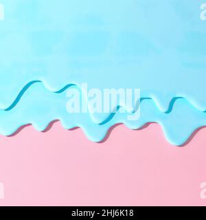 Pouring neo blue mint paint on pastel pink background. Creative abstract pattern with copy space. Stock Photo