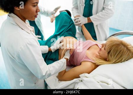 Woman giving birth in labor room of hospital Stock Photo - Alamy