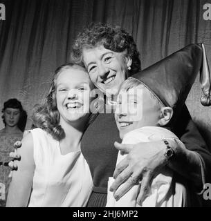 Children's Author Enid Blyton with 13-year-old Colin Spaull and 15-year-old Gloria Johnson, who have passed todays auditions and are to play Noddy and Silky in the Christmas production of 'Noddy in Toyland' at the Princes Theatre, London. 1957 Picture taken 14th November 1957 Stock Photo