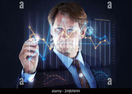 Technology making business easy. Cropped shot of a businessman writing on a hologram chart.All screen content is designed by us and not copyrighted by Stock Photo