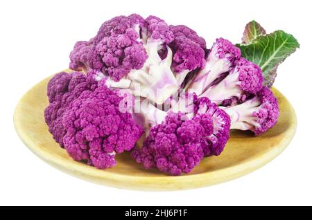 Purple Cauliflower slice in wooden dish isolated on white background, Save clipping path. Stock Photo