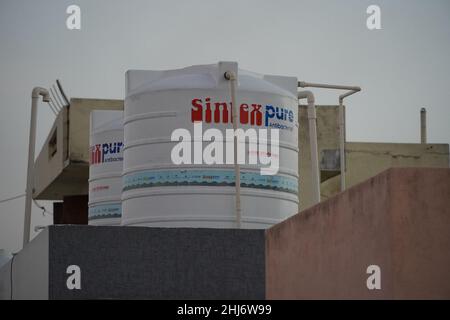 aTwin white sintex water tank on the roof of a house or industrial building on roof top or deck. : Udaipur India - June 2020 840 Stock Photo