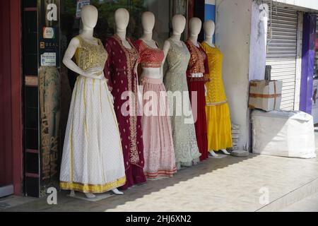 Mannequins dressed in latest fashion in front of retail clothes shop. Fashion and Retail Shopping concept. Mannequin Of Female Girls Wearing Colorful Stock Photo