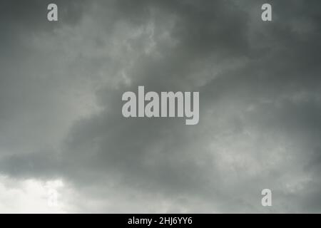Dark layers cloudy rain coming. Dark storm clouds background. Dark sky full of clouds before the rain. Landscape of dark cloudy sky before rain storm Stock Photo