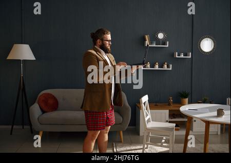 Freelance male worker video conferencing from home Stock Photo