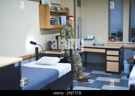 Daily life in the military dorms. Shot of a young soldier in the dorms of a military academy. Stock Photo
