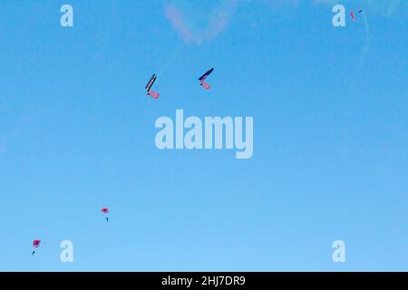 Skydivers descend on Sydney Harbour as part of the Australia Day 2022 festivities in Sydney, Australia. Stock Photo