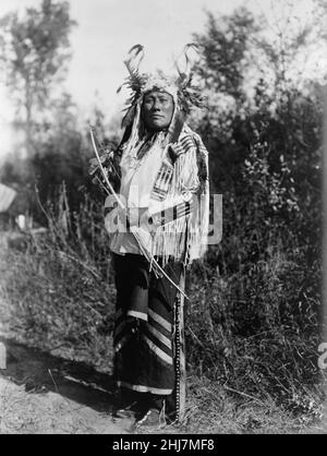 Long Time Dog--Hidatsa - Antique and vintage photo - Native american / Indian / American Indian man. Curtis, Edward S., 1868-1952, photographer. 1908 Stock Photo