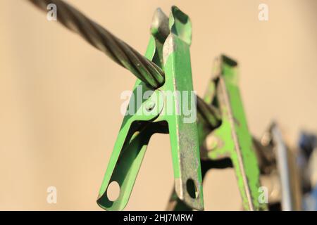 clothes pin hanging on wire. Stock Photo
