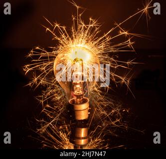 light bulb back lit by a sparkler Stock Photo