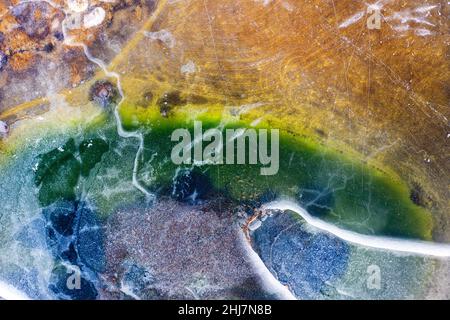 Abstract natural icy background. Frozen lake. Patterns on the surface of a frozen lake Stock Photo