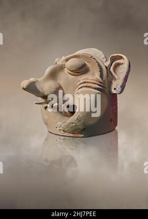 Ancient Greek Ceremonial terracotta masks depicting mythical creatures, Tiryns, Upper Citadel 'Bothros', 7th cent BC. Nafplion Archaeological Museum. Stock Photo