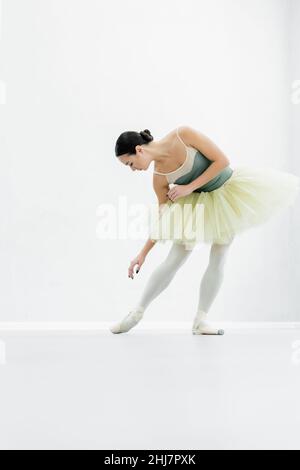 young ballerina practicing choreographic elements during repetition Stock Photo