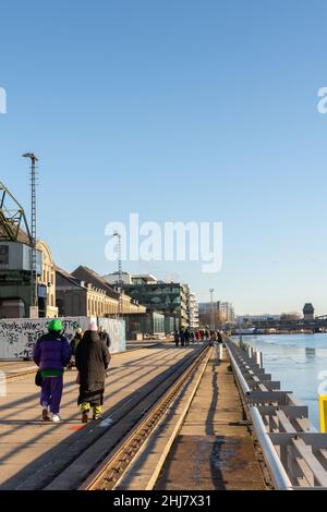 Berlin, Germany - December 26, 2021: view of the other shore from the Spree river embankment between the Oberbaunum bridge and Elsen Bridge Stock Photo