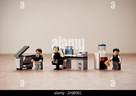 Colleagues working in the office. Illustrative editorial. January 09, 2022 Stock Photo