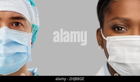 close up of doctors in protective medical masks Stock Photo