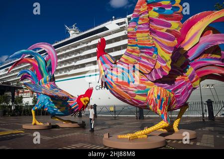Sydney, Australia - 16 February 2018: Visitor posing in front of huge rooster displays as chinese zodiac sign set up for Chinese lunar new year in fro Stock Photo