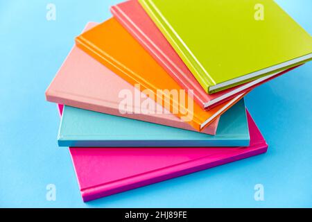 notebooks or books on blue background Stock Photo