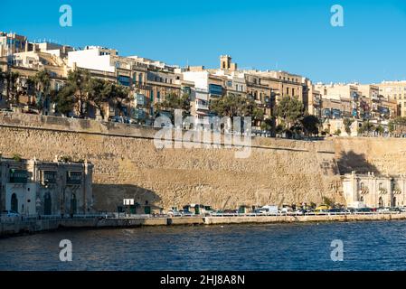 Valletta, Malta - 01 06 2022: Panoramic view over the harbor and coastal line with blue water and sky Stock Photo