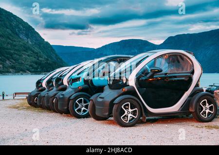 Many Black And Blue Colors Renault Z.E. Cars Parked In row. The Renault Z.E. or Zero Emission is a line of all-electric cars from Renault Stock Photo