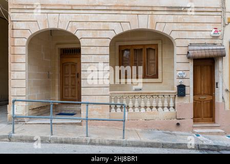 Marsaxlokk, Malta - 01 07 2022: Decorated facade with patio and wooden doors Stock Photo