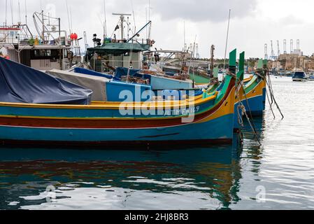 Marsaxlokk, Malta - 01 07 2022: Colorful fishermen boats at the port Stock Photo