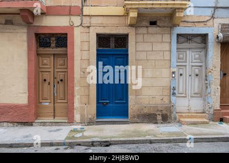 Marsaxlokk, Malta - 01 07 2022: Colorful doors of a facade at the fisherman harbor Stock Photo