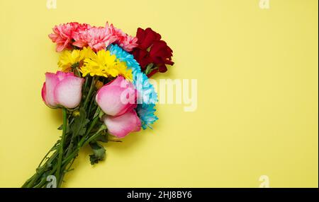 Send flowers online concept. Flower delivery for valentine and mother day. Bouquet of red pink roses isolated on violet background. Post card design w Stock Photo