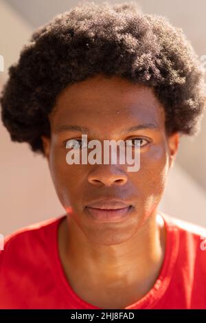Close-up portrait of confident african american young man with afro hairstyle. unaltered, lifestyle, leisure activity and active lifestyle concept. Stock Photo
