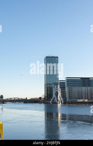 Berlin, Germany - December 26, 2021: view of the other shore from the Spree river embankment between the Oberbaunum bridge and Elsen Bridge Stock Photo