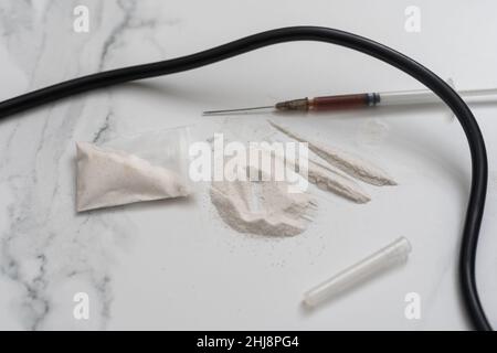 Drugs of various kinds and human skulls on the floor, Collection of different hard drugs Heroin Stock Photo